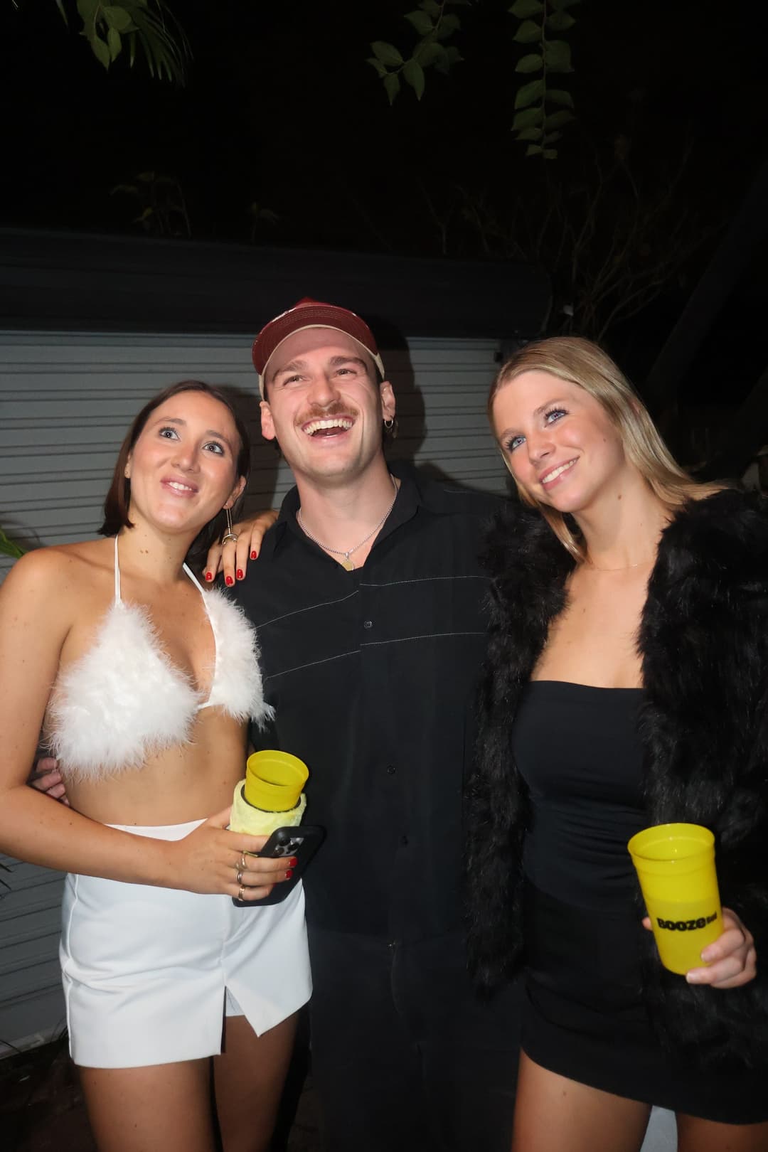 Winner Maddy and her mates with their BoozeBud cans