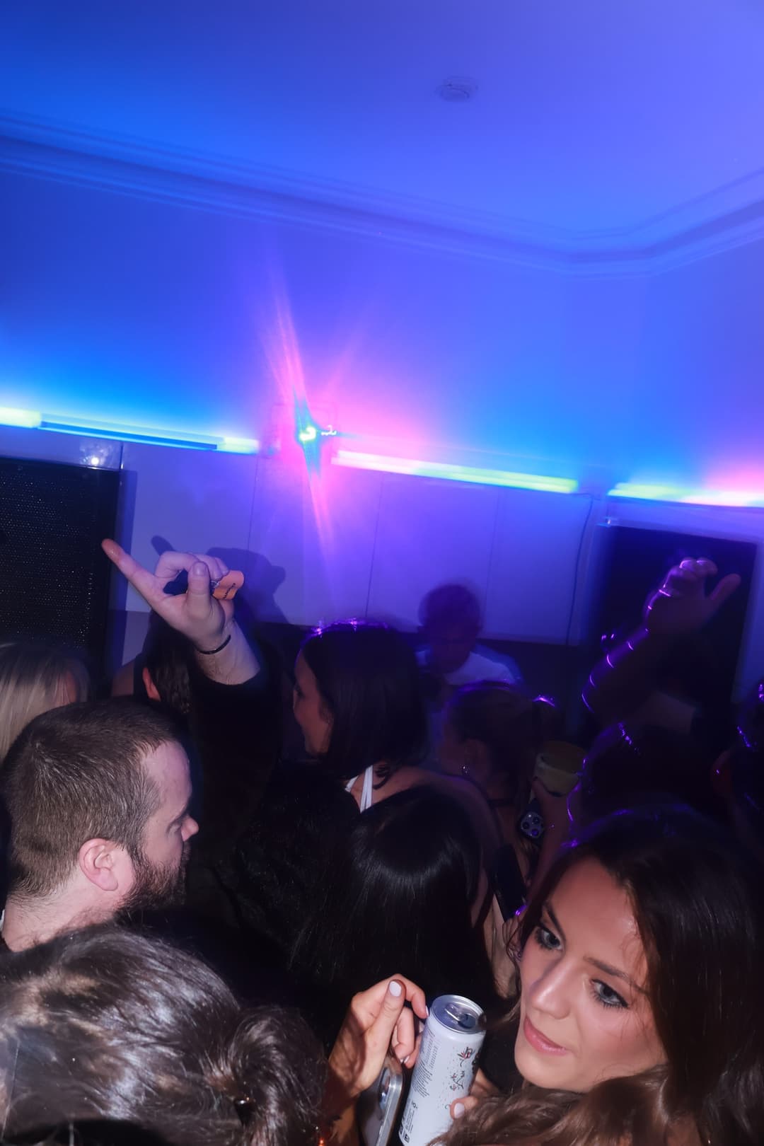 The crowd in pink light