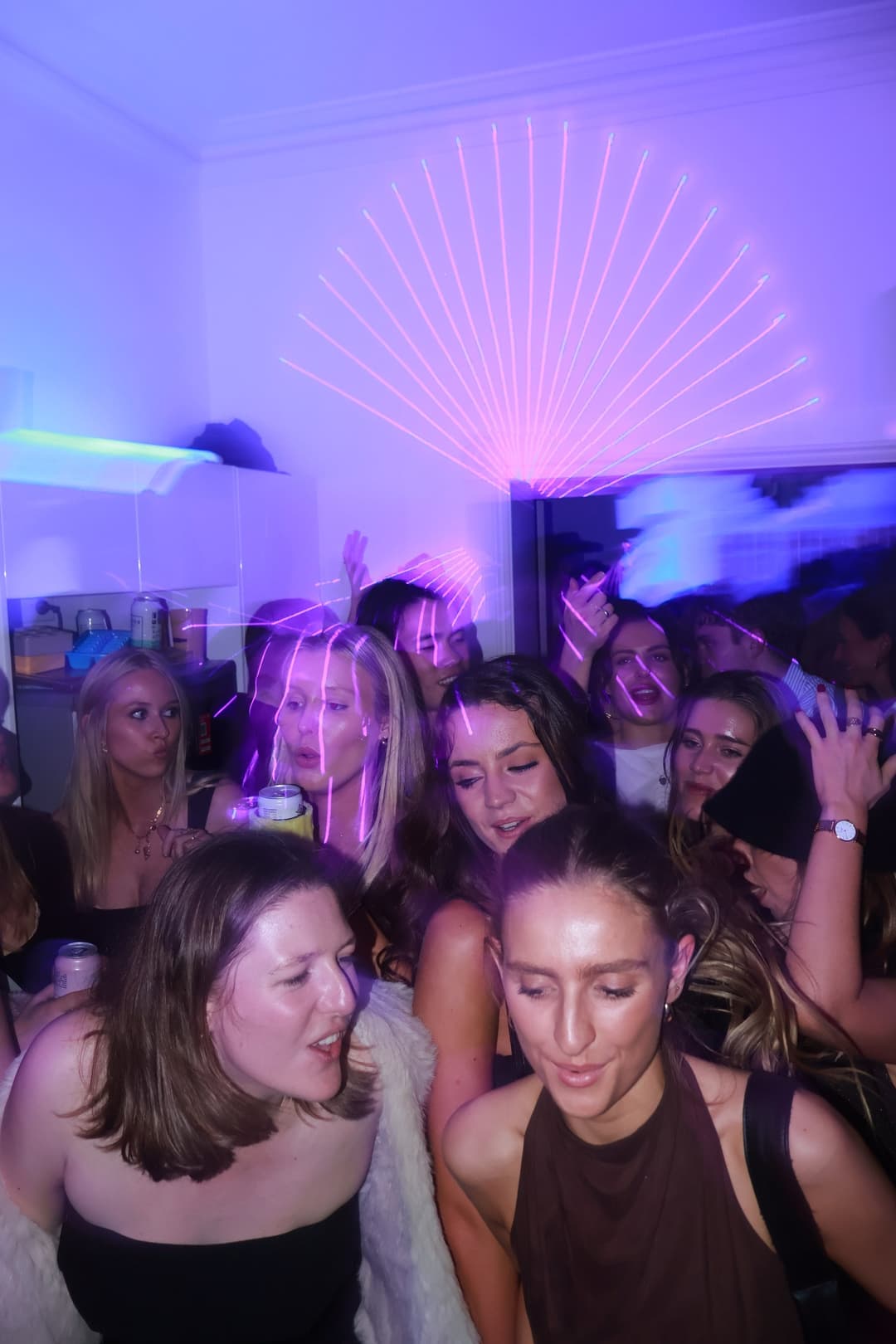 The crowd under the ceiling lights