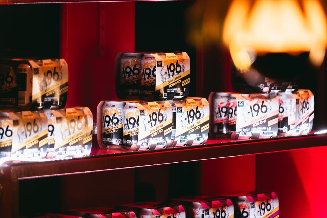-196 four-packs on a red shelf